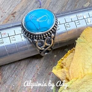 Big turquoise silver ring featuring